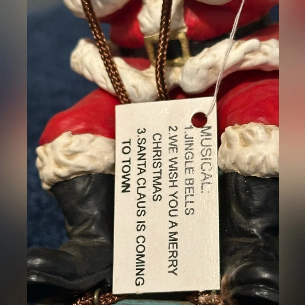 Musical vibrating Santa on his sleigh. Plays 3 songs!